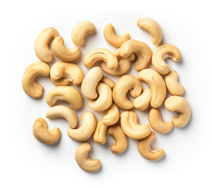 Crispy roasted cashews in white bowl Crispy roasted cashews in white bowl, cashew image
