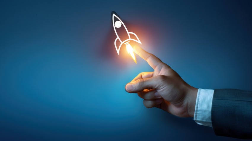 Businessman’s hand touching for rocket icon on dark blue background symbolizing startup success Businessman’s hand touching for rocket icon on dark blue background symbolizing startup success