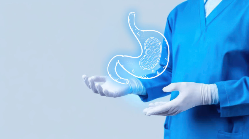 Doctor in blue uniform with white gloves holding out hand with a glowing stomach illustration