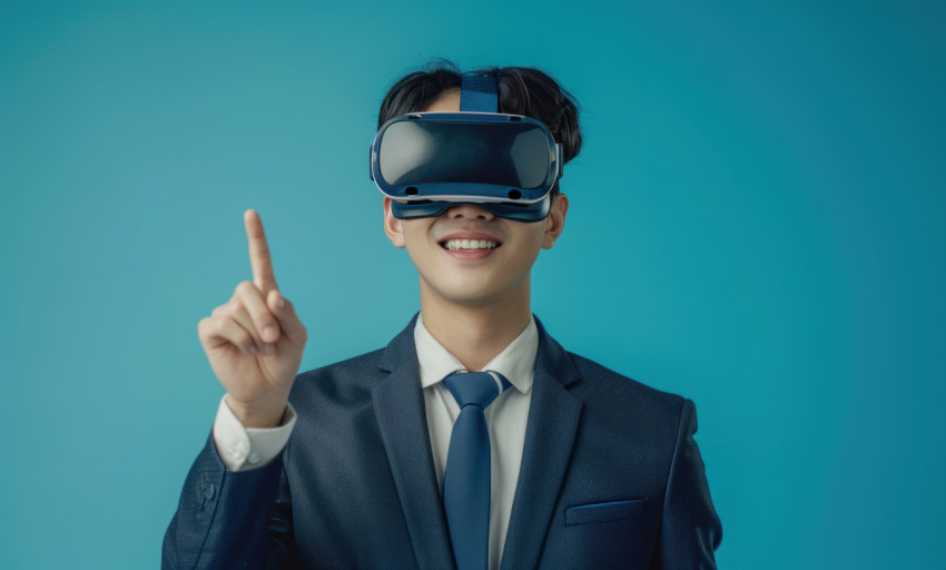 Suited man gestures to VR headset Suited man gestures to VR headset