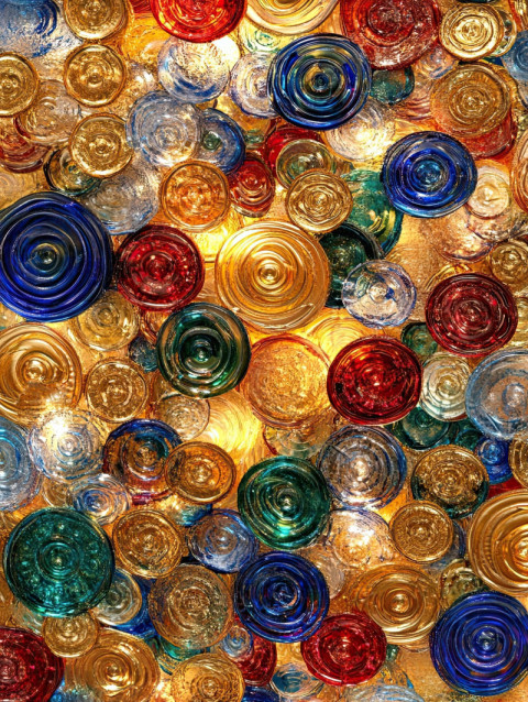 Golden coins arranged in a swirling pattern Golden coins arranged in a swirling pattern