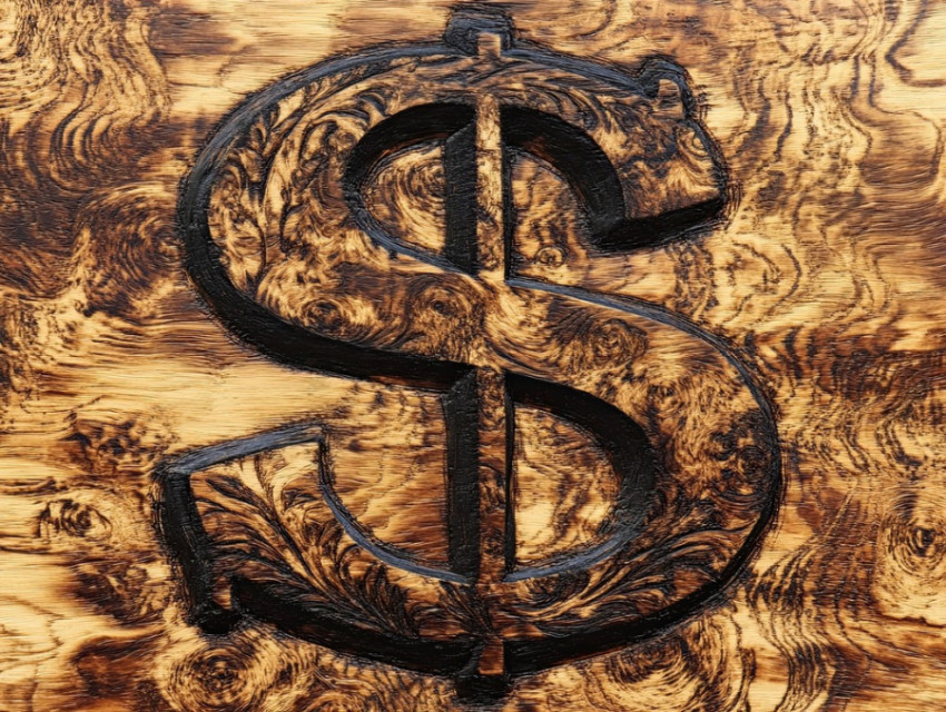 Burned dollar sign on wood Burned dollar sign on wood