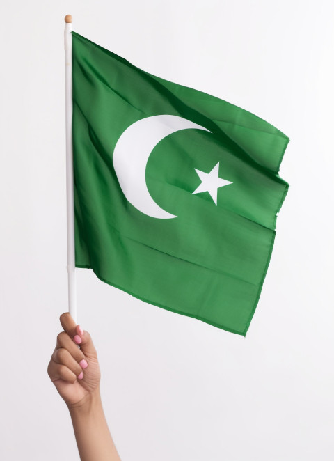 Woman hand holds pakistani flag Woman hand holds pakistani flag, pakistan independence day photos