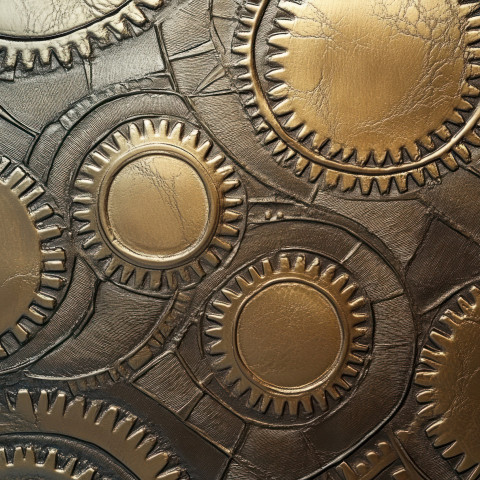 Embossed gears turning within a machine representing industry and mechanics Embossed gears turning within a machine representing industry and mechanics