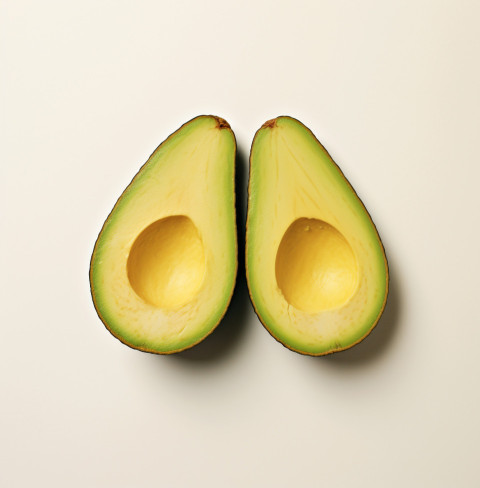Avocado cut in half on white background Avocado cut in half on white background, avocado image stock photo